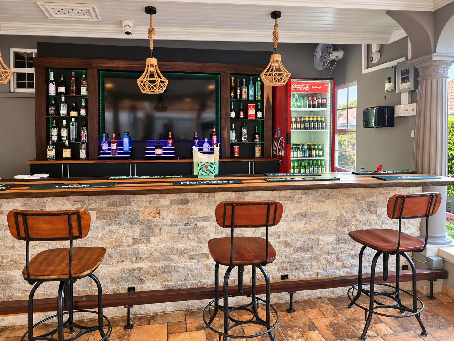 The Patio’s bar counter, stools and bottle display