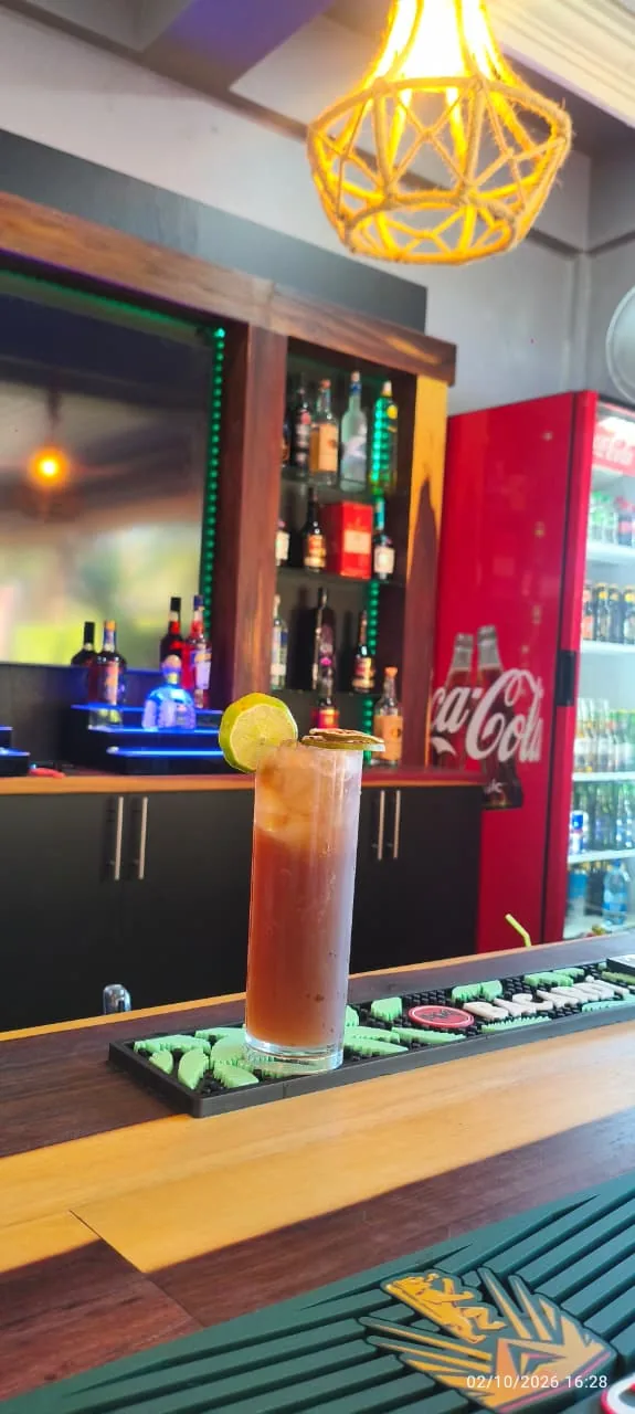 Cuba libre with a lime garnish at The Patio’s bar