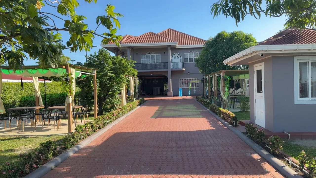 The Patio courtyard and outdoor seating beside the restaurant entrance